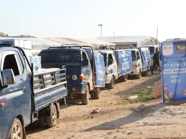 Children smiling with their Ramadan baskets